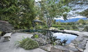 Discover the dear little gazebo by the pond